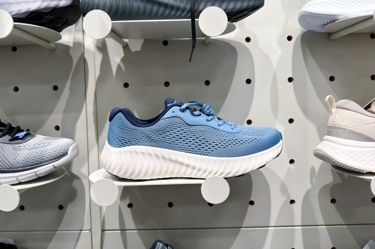 Sleek blue athletic shoe with white textured sole