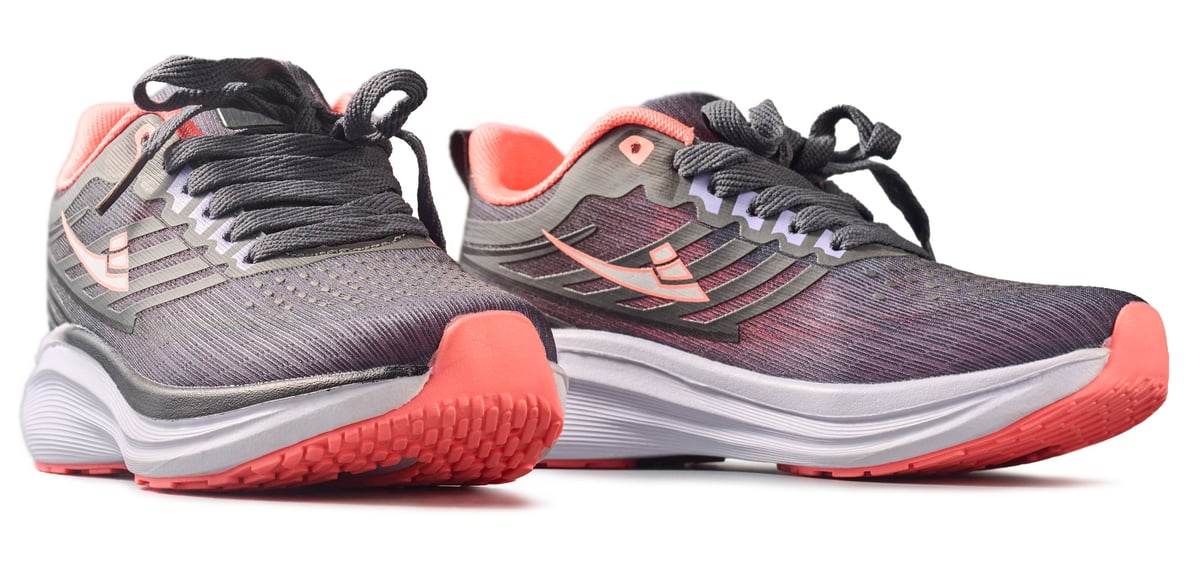 Grey and pink running shoes with thick sole