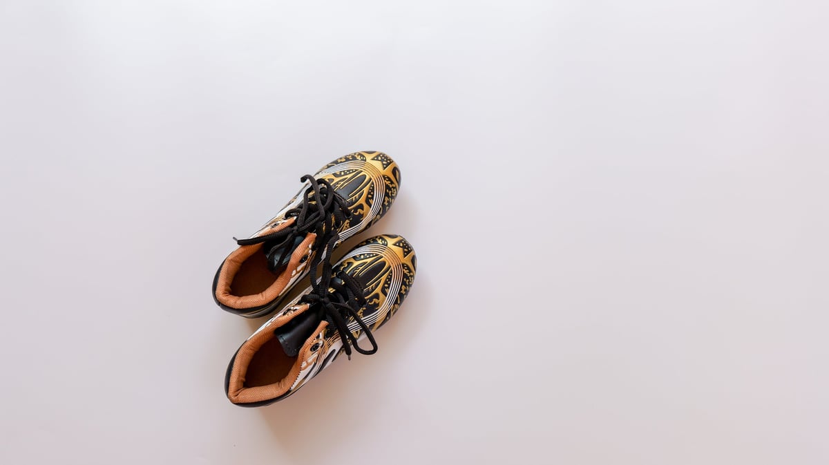 Two stylish athletic shoes with unique motifs